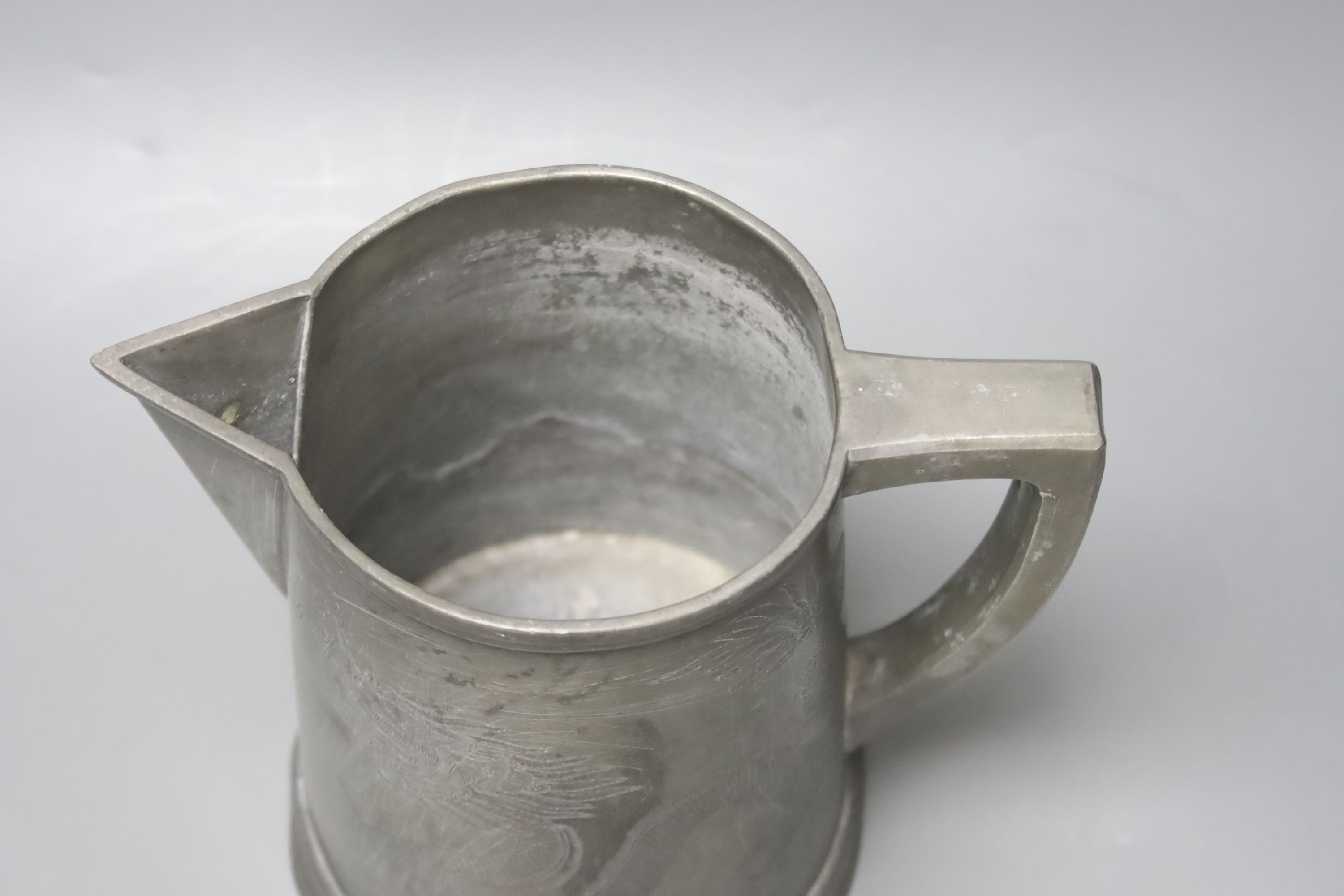 A late 19th century Chinese dragon pewter jug, 18cm high